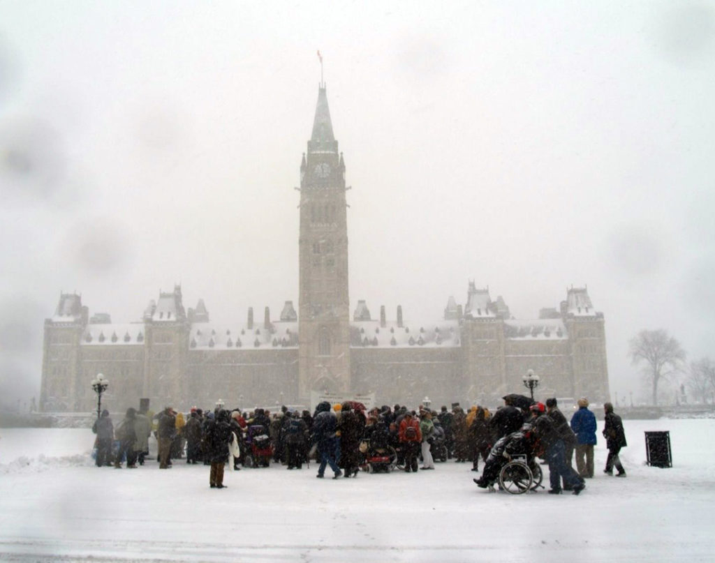 CACL and advocates outside Canadian Parliament in snow storm.