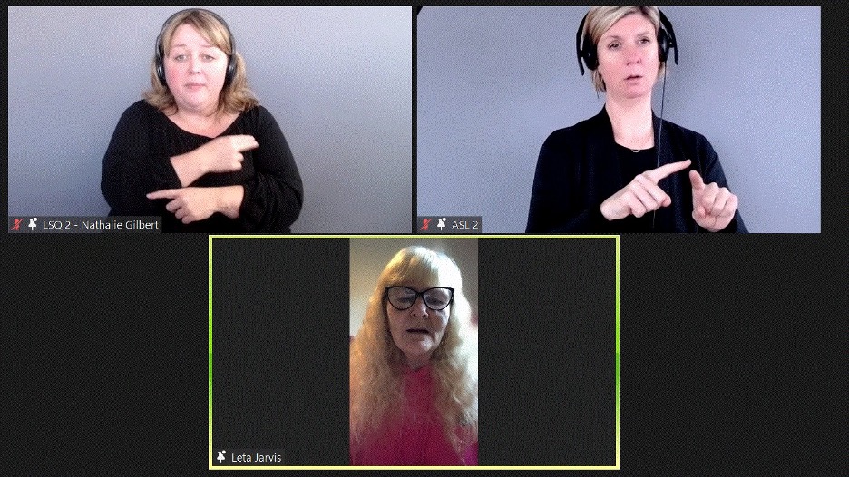 Leta Jarvis speaking on a Zoom call with ASL and LSQ interpreters pinned in different boxes 